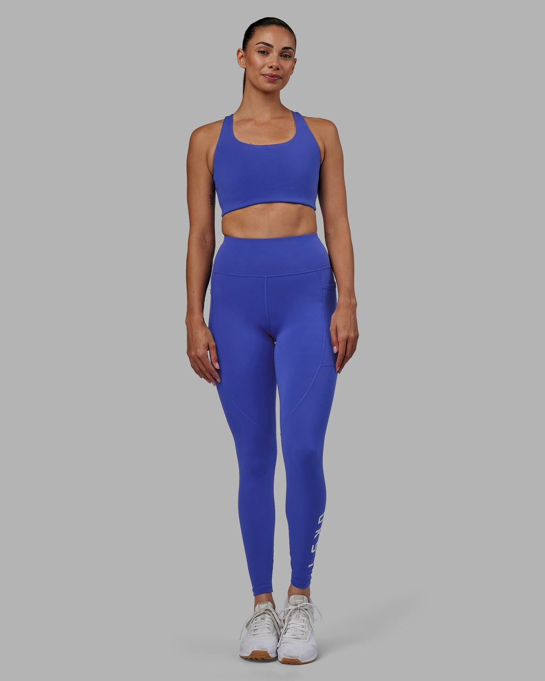 Woman wearing Rep Full Length Leggings - Power Cobalt-White