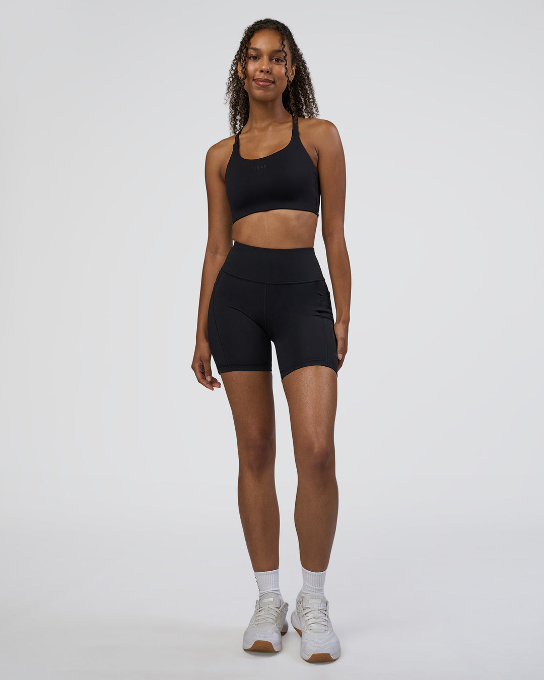 Woman wearing Rep Ultra High-Rise 6&quot; Short Pockets - Black-Black | Model:Jordan | Size:S