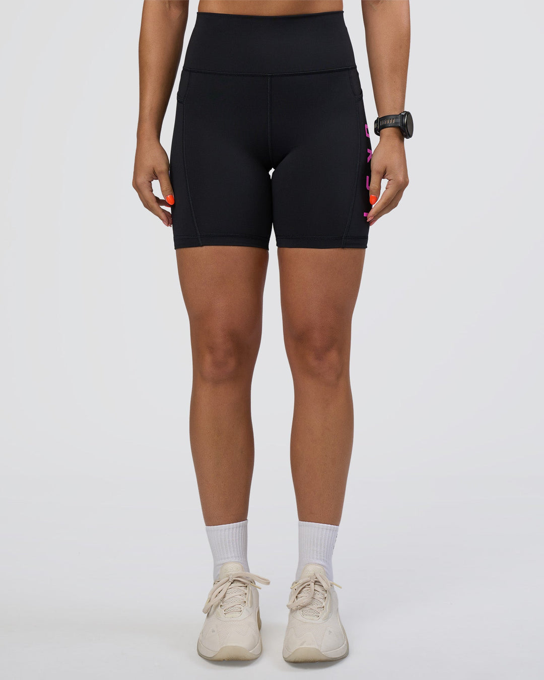 Woman wearing Rep Ultra High-Rise 6" Short Pockets - Black-Ultra Fuchsia | Model:Abbey | Size:S