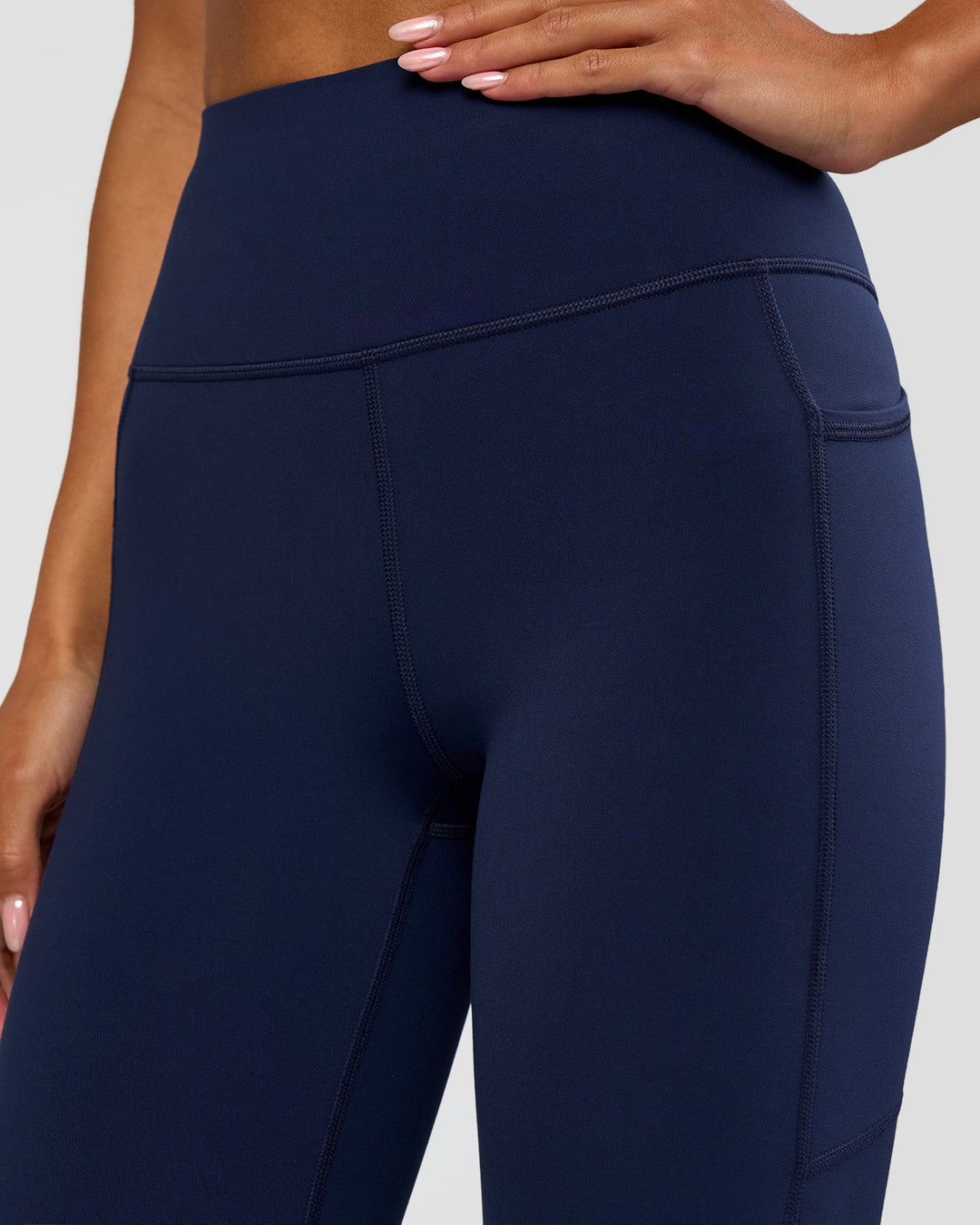 Woman wearing Rep Ultra High-Rise 3/4 Legging Pockets - Future Navy-White | Model:Dakota | Size:S