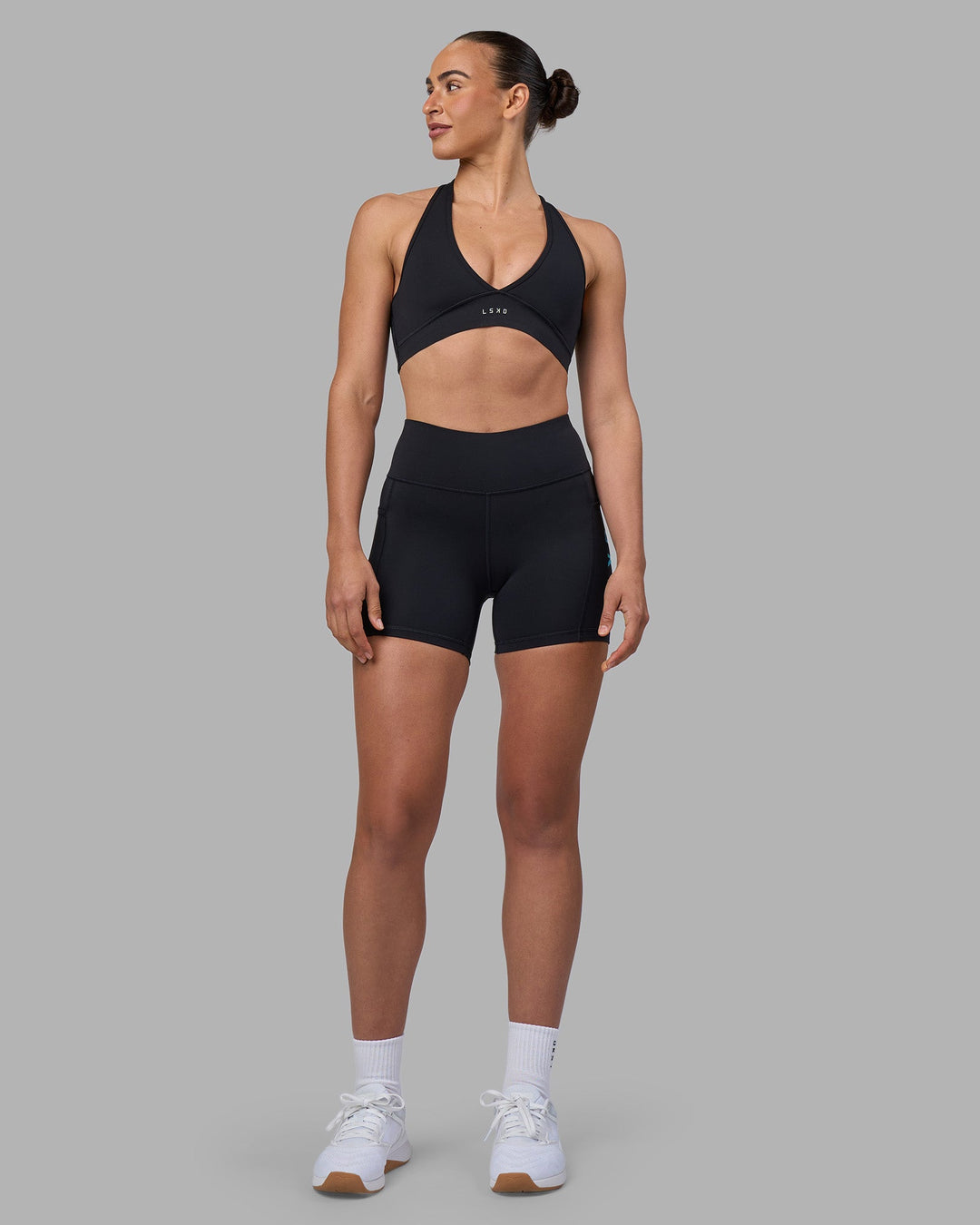 Woman wearing Rep Ultra High-Rise 4&quot; Short Pockets - Black-Blue Atoll | Model:Sophie | Size:S