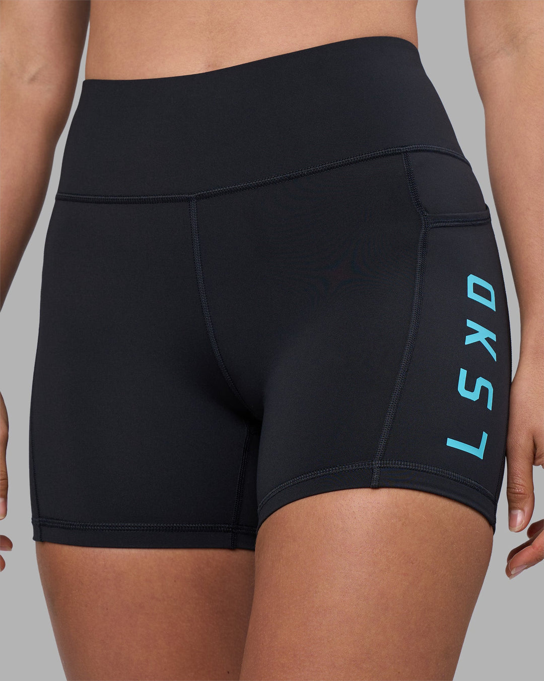 Woman wearing Rep Ultra High-Rise 4&quot; Short Pockets - Black-Blue Atoll | Model:Sophie | Size:S