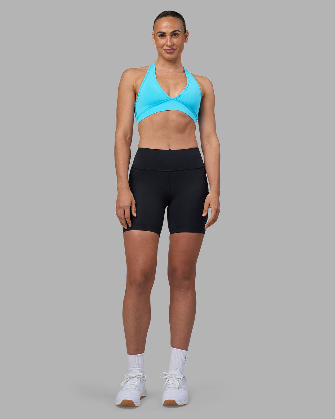 Woman wearing Rep Ultra High-Rise 6&quot; Short Pockets - Black-Blue Atoll | Model:Sophie | Size:S