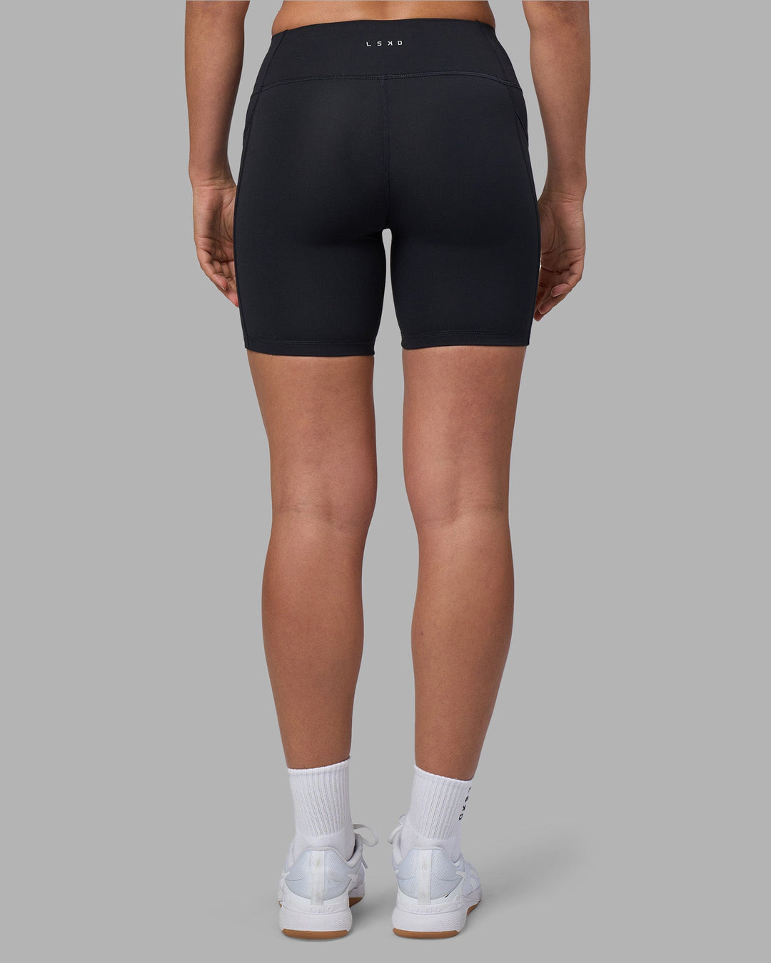 Woman wearing Rep Ultra High-Rise 6&quot; Short Pockets - Black-Blue Atoll | Model:Sophie | Size:S