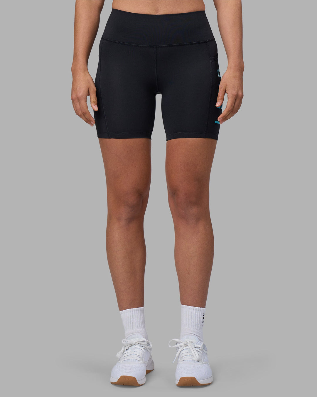 Woman wearing Rep Ultra High-Rise 6&quot; Short Pockets - Black-Blue Atoll | Model:Sophie | Size:S