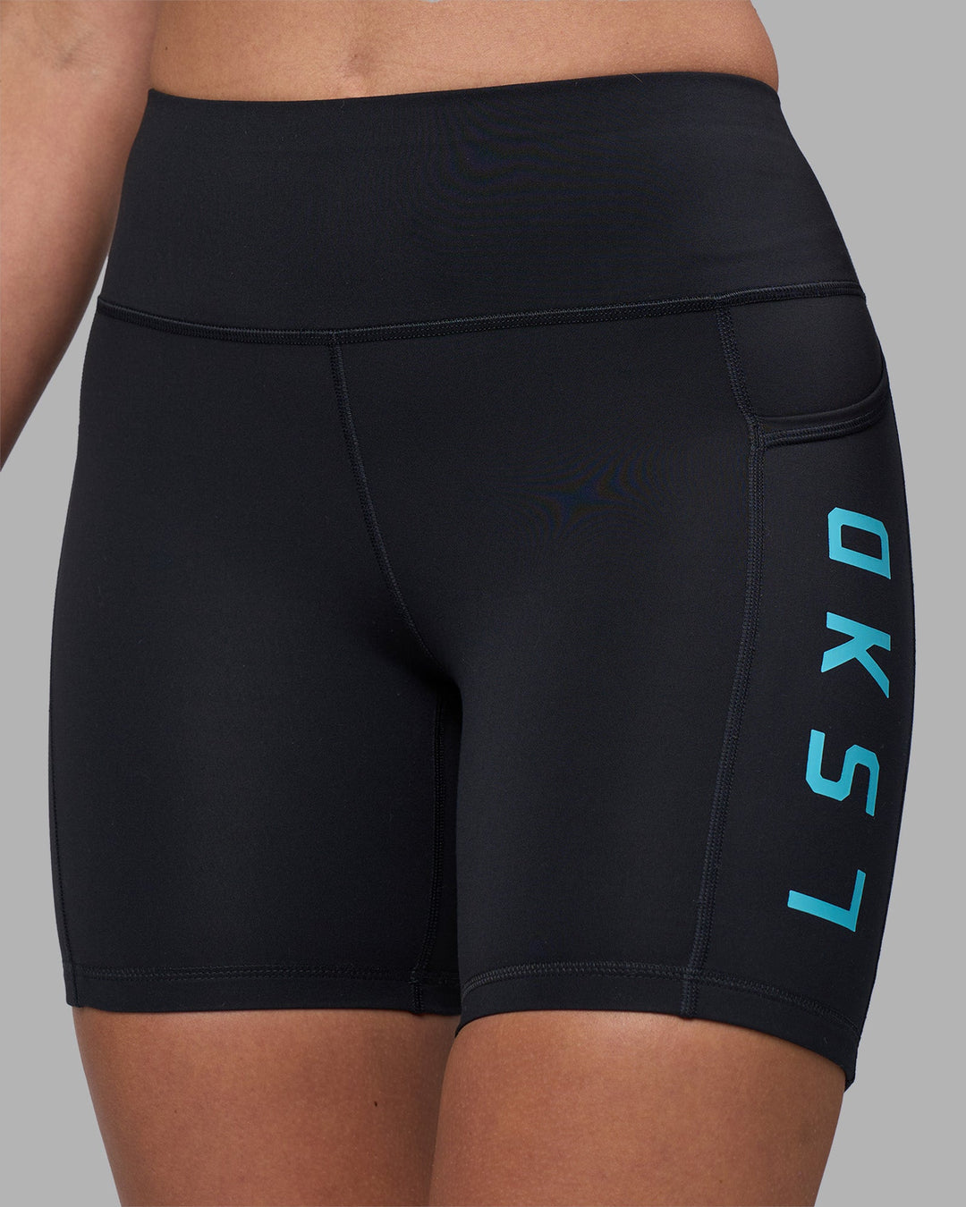 Woman wearing Rep Ultra High-Rise 6&quot; Short Pockets - Black-Blue Atoll | Model:Sophie | Size:S