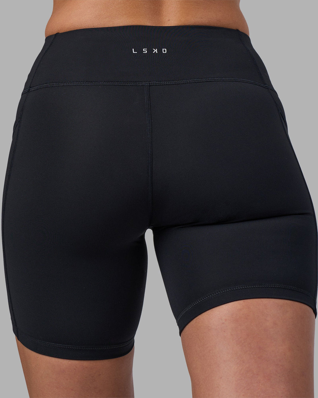 Woman wearing Rep Ultra High-Rise 6&quot; Short Pockets - Black-Blue Atoll | Model:Sophie | Size:S