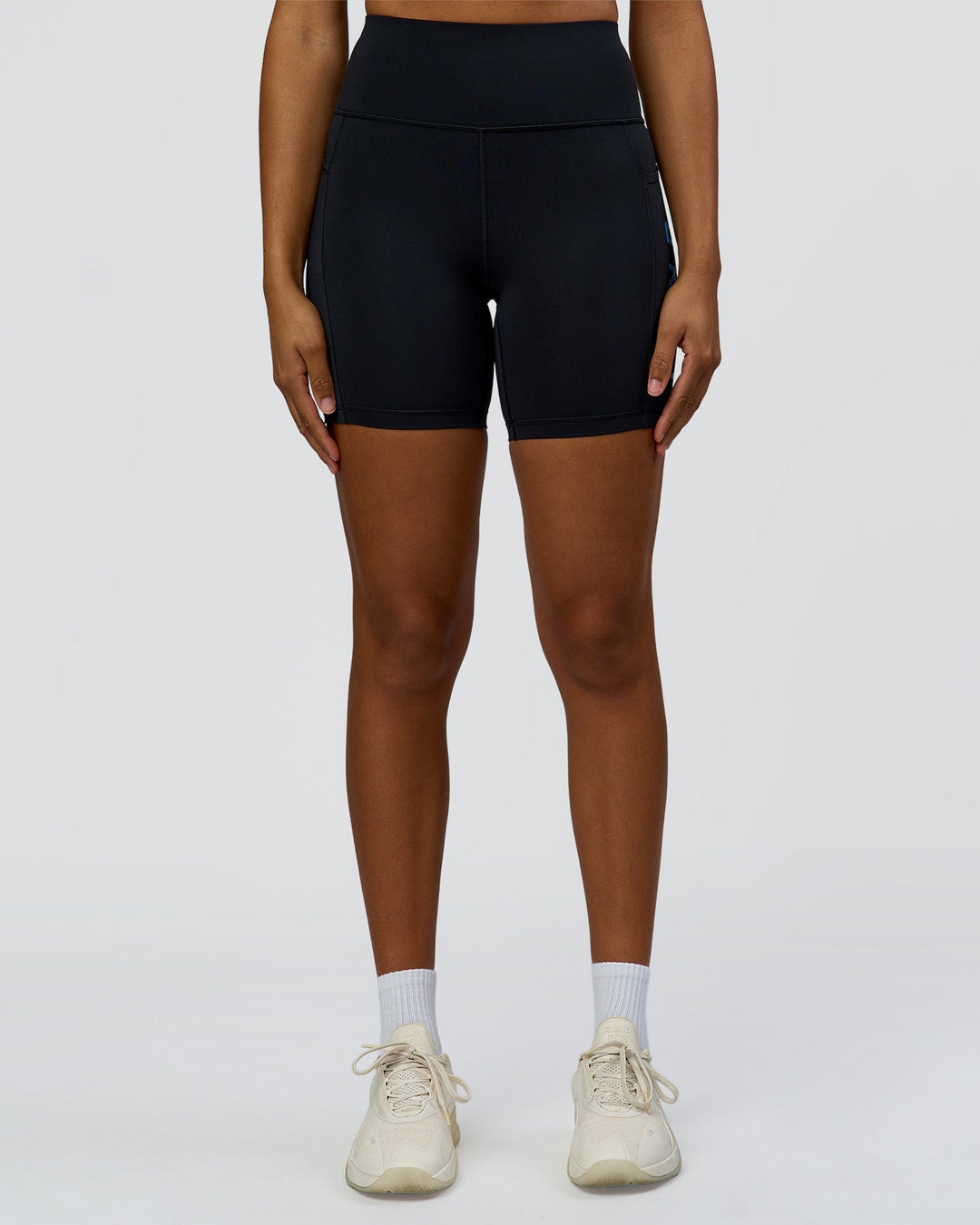 Woman wearing Rep Ultra High-Rise 6" Short Pockets - Black-Palace Blue | Model:Rosie | Size:S