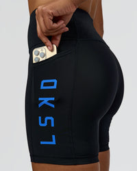 Woman wearing Rep Ultra High-Rise 6" Short Pockets - Black-Palace Blue | Model:Rosie | Size:S