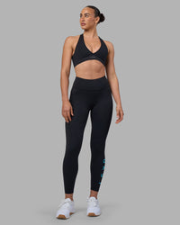 Woman wearing Rep Ultra High-Rise 7/8 Legging Pockets - Black-Blue Atoll | Model:Sophie | Size:S | Thumbnail Index: 4