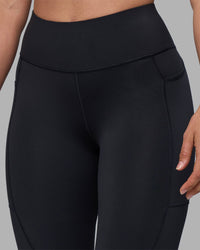 Woman wearing Rep Ultra High-Rise 7/8 Legging Pockets - Black-Blue Atoll | Model:Sophie | Size:S | Thumbnail Index: 7