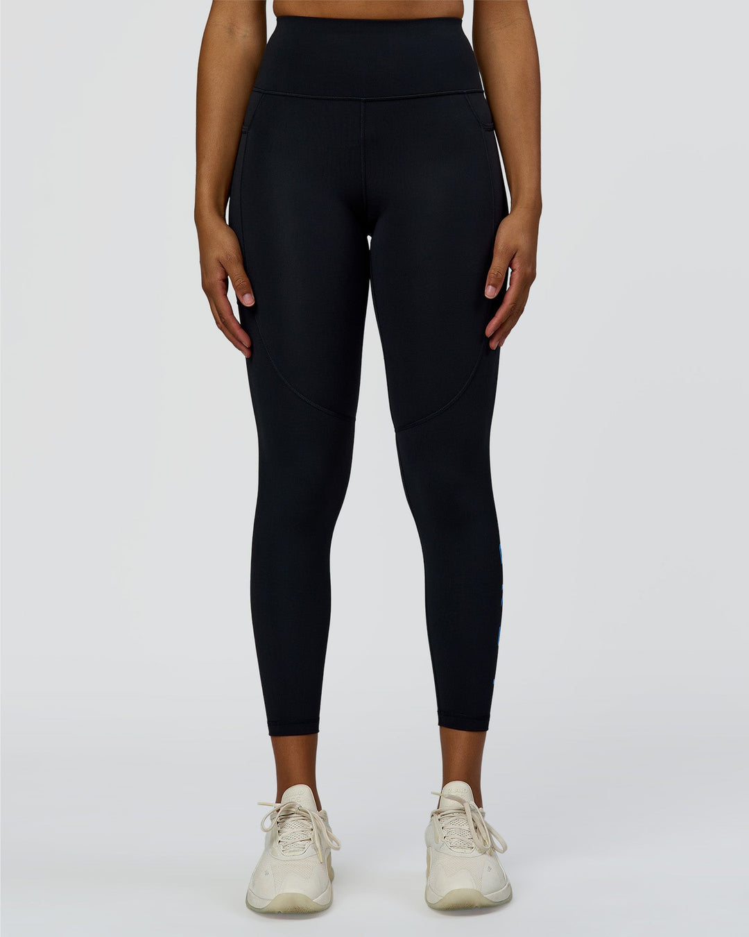 Woman wearing Rep Ultra High-Rise 7/8 Legging Pockets - Black-Palace Blue | Model:Rosie | Size:S