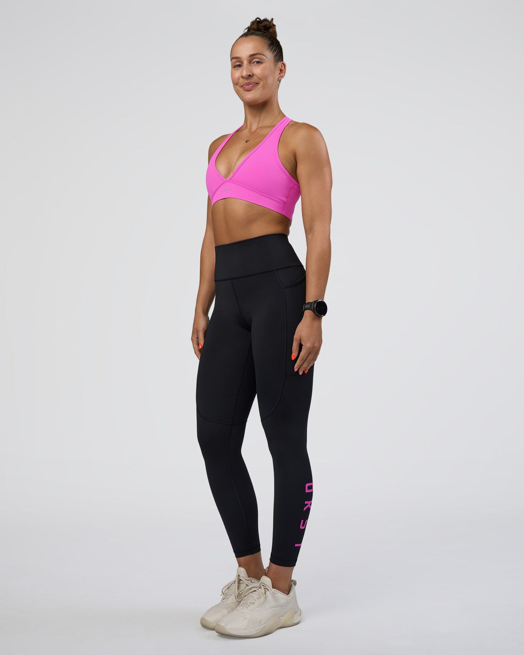 Woman wearing Rep Ultra High-Rise 7/8 Legging Pockets - Black-Ultra Fuchsia | Model:Abbey | Size:S