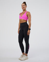 Woman wearing Rep Ultra High-Rise 7/8 Legging Pockets - Black-Ultra Fuchsia | Model:Abbey | Size:S
