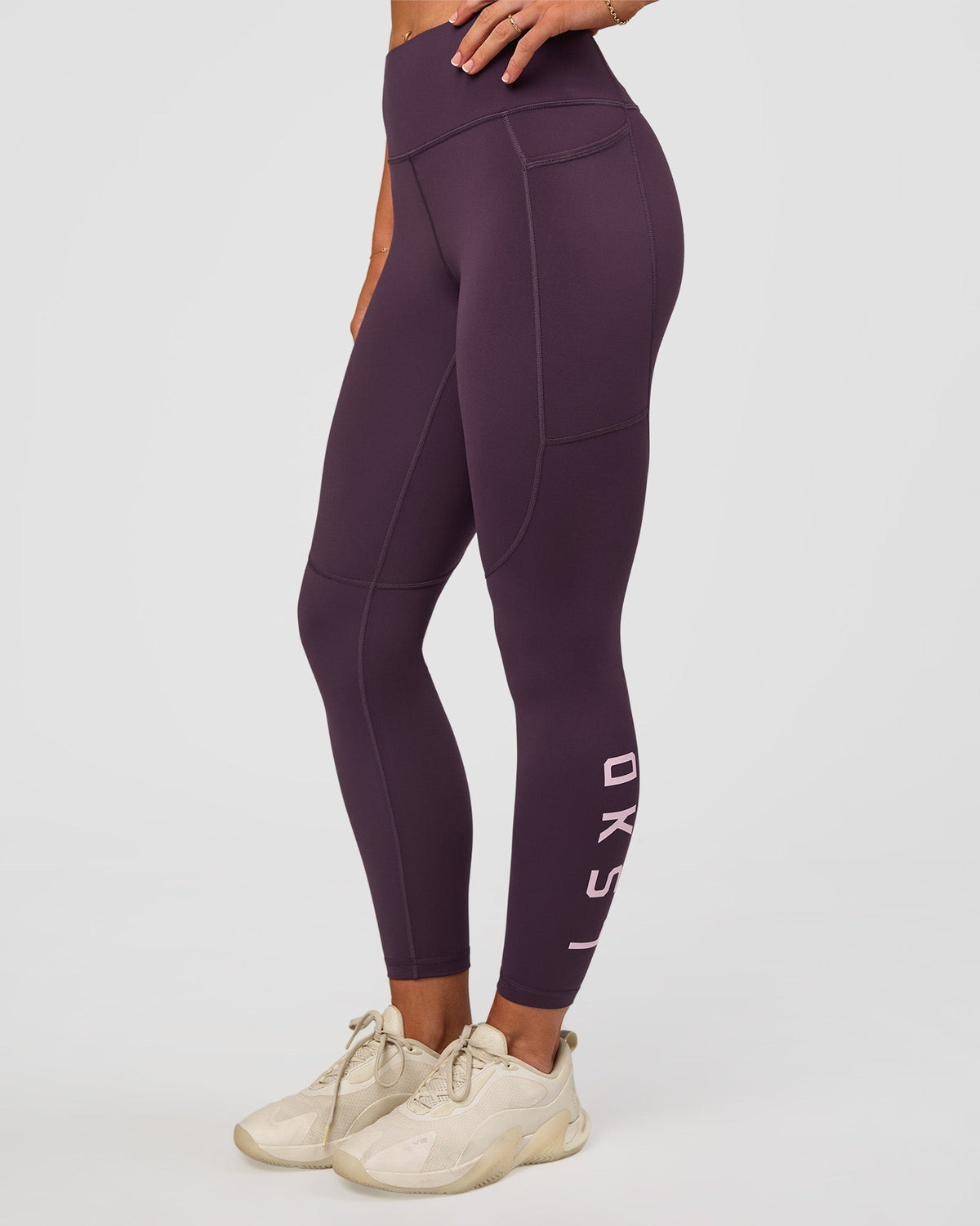 Woman wearing Rep Ultra High-Rise 7/8 Legging Pockets - Midnight Plum-Marshmallow | Model:Emelia | Size:S - view 2