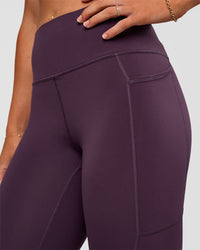 Woman wearing Rep Ultra High-Rise 7/8 Legging Pockets - Midnight Plum-Marshmallow | Model:Emelia | Size:S | Thumbnail Index: 7