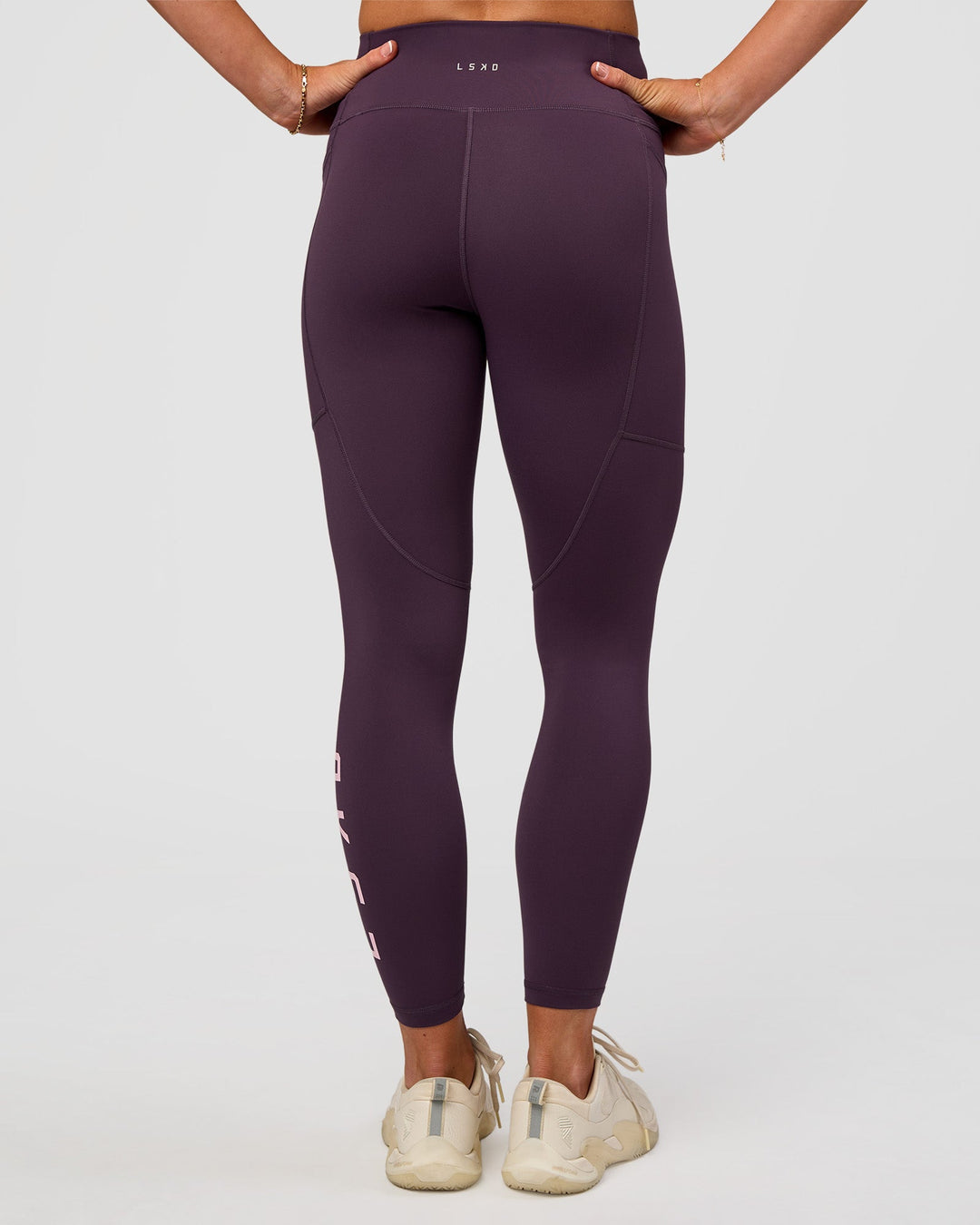 Woman wearing Rep Ultra High-Rise 7/8 Legging Pockets - Midnight Plum-Marshmallow | Model:Emelia | Size:S - view 6
