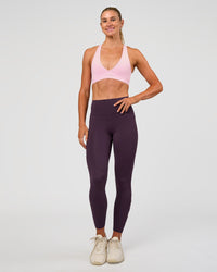 Woman wearing Rep Ultra High-Rise 7/8 Legging Pockets - Midnight Plum-Marshmallow | Model:Emelia | Size:S | Thumbnail Index: 4