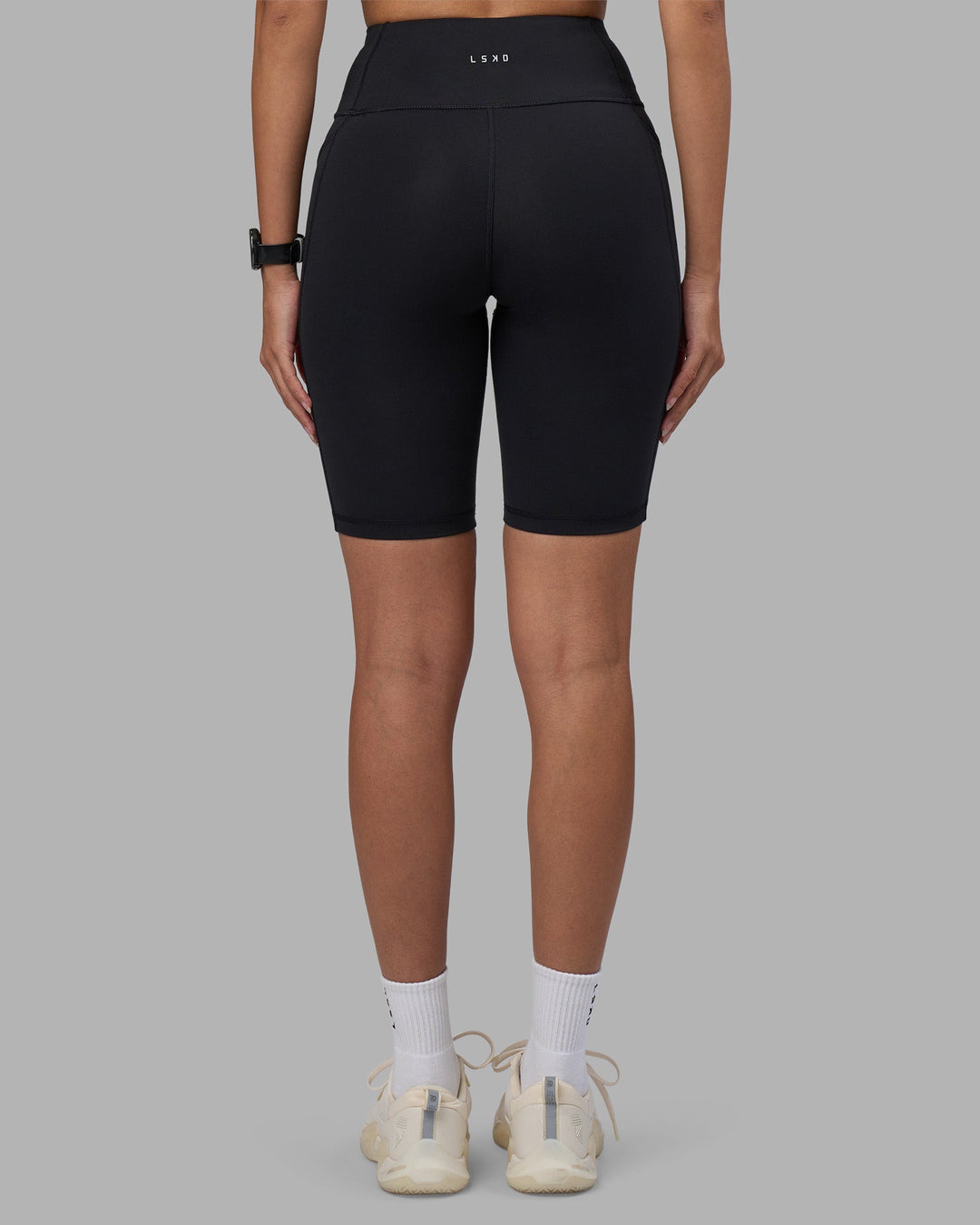 Woman wearing Rep Ultra High-Rise 9&quot; Short Pockets - Black-Power Cobalt | Model:Rhiley | Size:S