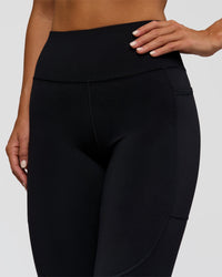 Woman wearing Rep Ultra High-Rise Full Length Legging Pockets - Black-Palace Blue | Model:Amity | Size:S