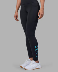 Woman wearing Rep Ultra High-Rise Full Length Legging Pockets - Black-Blue Atoll | Model:Sophie | Size:S | Thumbnail Index: 1