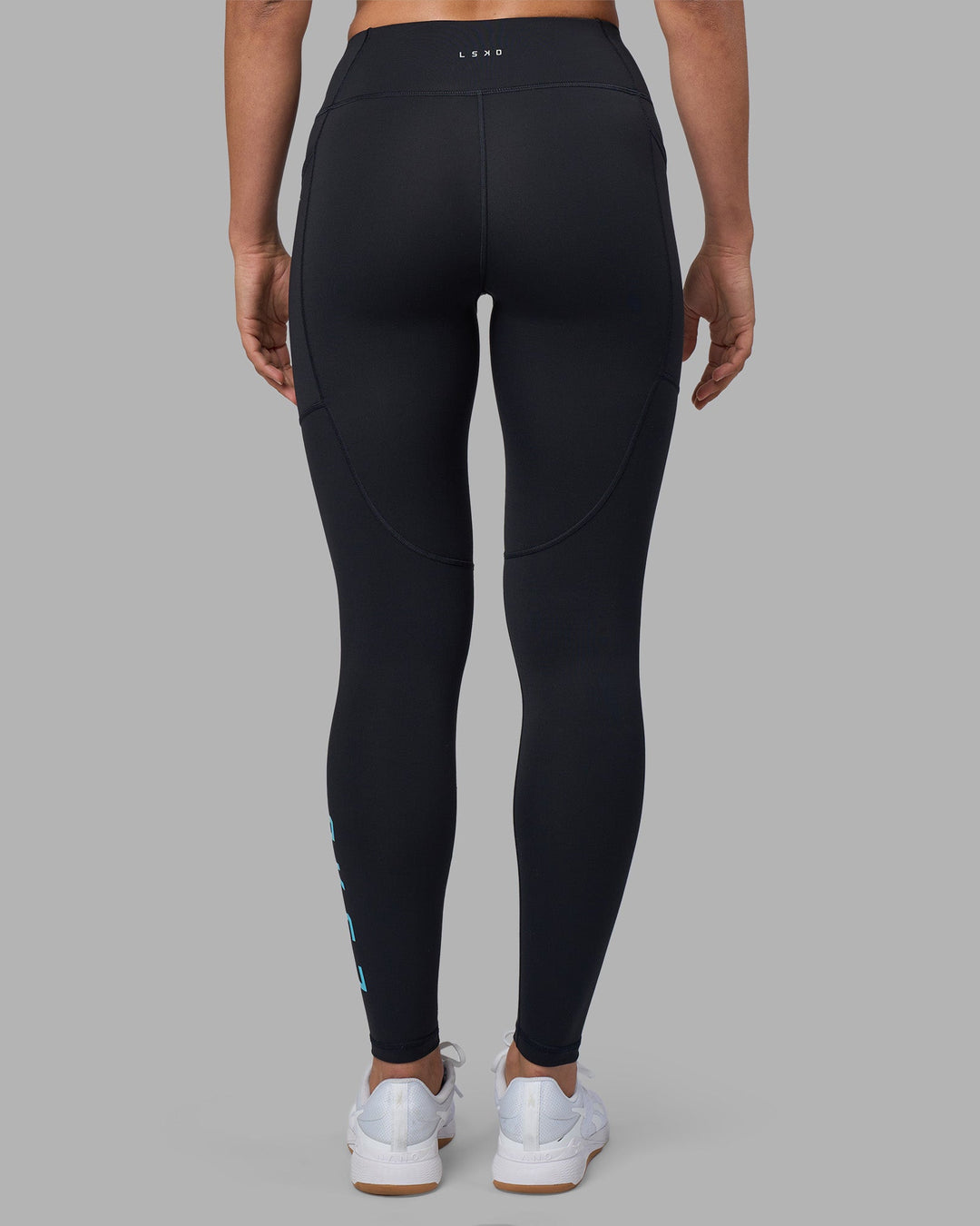 Woman wearing Rep Ultra High-Rise Full Length Legging Pockets - Black-Blue Atoll | Model:Sophie | Size:S