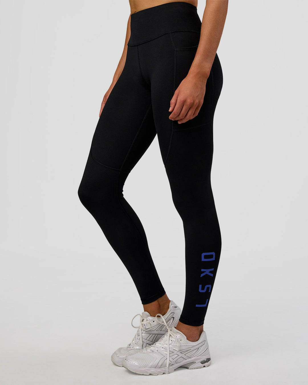 Woman wearing Rep Ultra High-Rise Full Length Legging Pockets - Black-Electric Indigo | Model:Evie | Size:S