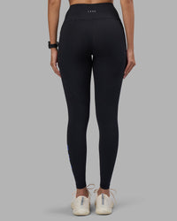 Woman wearing Rep Ultra High-Rise Full Length Legging Pockets - Black-Power Cobalt | Model:Rhiley | Size:S