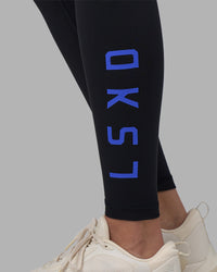 Woman wearing Rep Ultra High-Rise Full Length Legging Pockets - Black-Power Cobalt | Model:Rhiley | Size:S