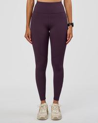 Woman wearing Rep Ultra High-Rise Full Length Legging Pockets - Midnight Plum-Marshmallow | Model:Rhiley | Size:S