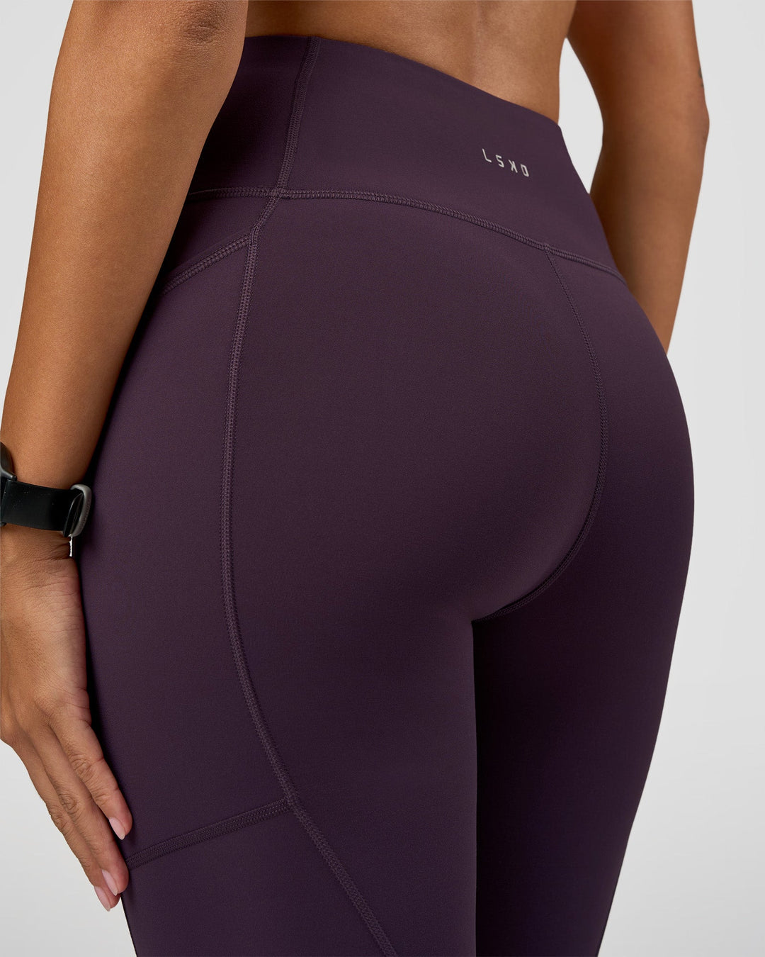 Woman wearing Rep Ultra High-Rise Full Length Legging Pockets - Midnight Plum-Marshmallow | Model:Rhiley | Size:S