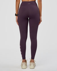 Woman wearing Rep Ultra High-Rise Full Length Legging Pockets - Midnight Plum-Marshmallow | Model:Rhiley | Size:S