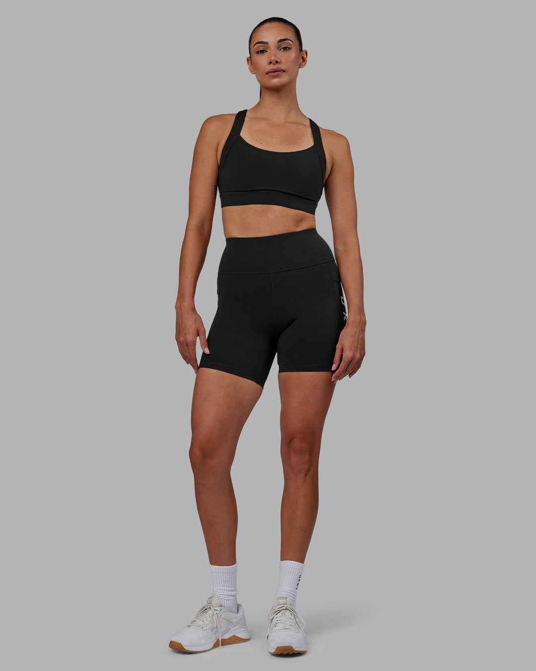 Woman wearing Rep Mid-Length Shorts - Pirate Black-White