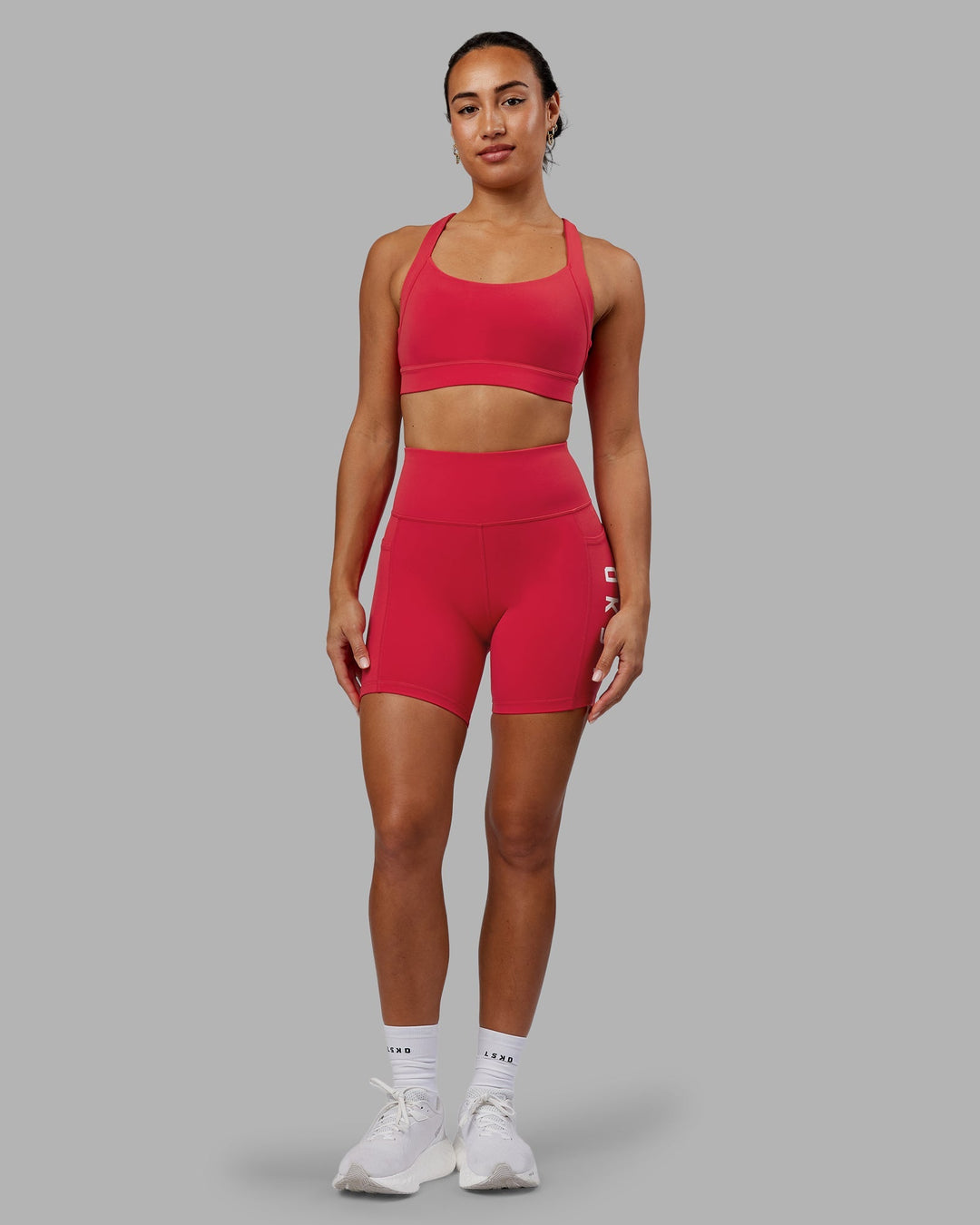 Woman wearing Rep Mid-Length Shorts - Scarlet-White