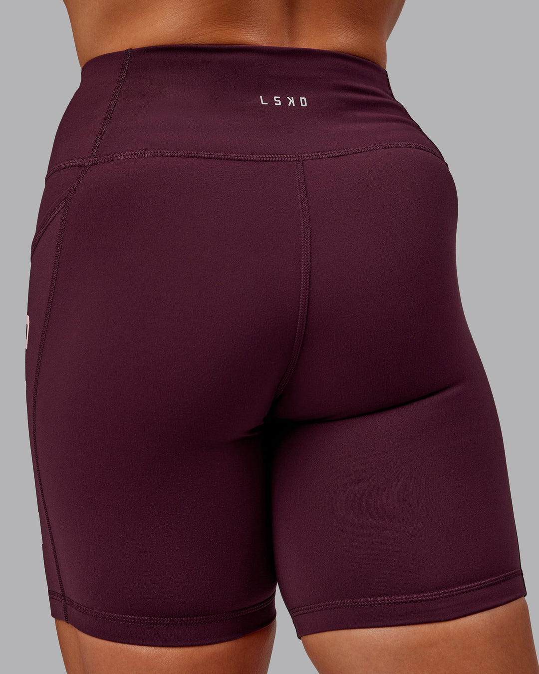 Woman wearing Rep Mid Short Tights - Cherry Lacquer-Marshmallow