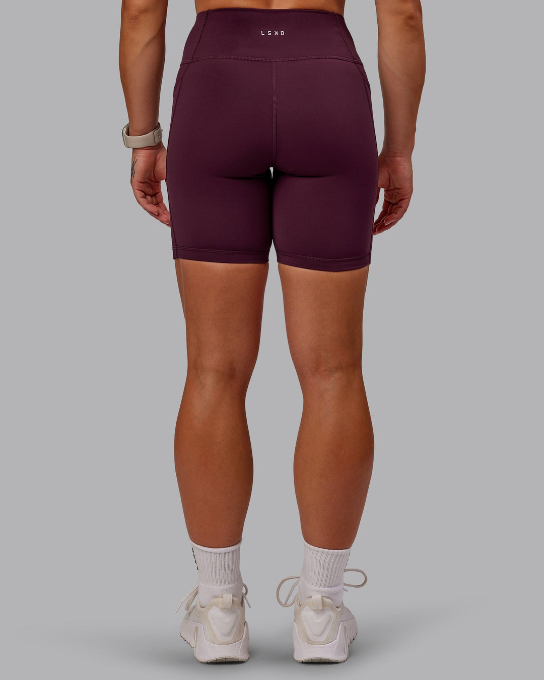 Woman wearing Rep Mid Short Tights - Cherry Lacquer-Marshmallow