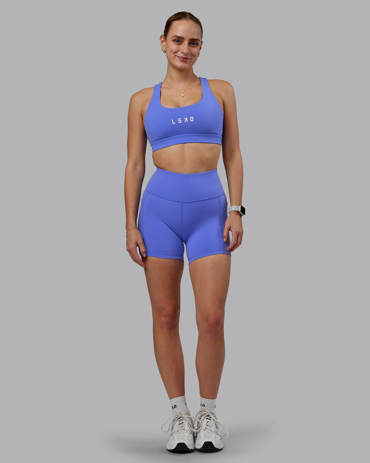 Woman wearing Rep Sports Bra - Baja Blue-White
