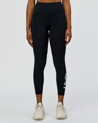 Woman wearing Rep Street Script Ultra High-Rise 7/8 Legging Pockets - Black-White | Model:Rosie | Size:S