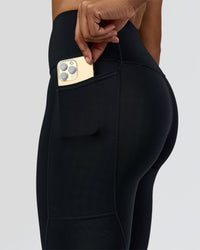 Woman wearing Rep Street Script Ultra High-Rise 7/8 Legging Pockets - Black-White | Model:Rosie | Size:S