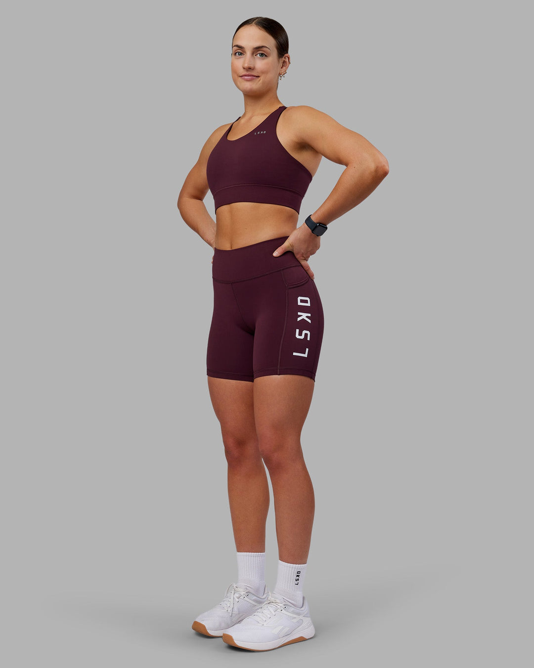 Woman wearing Rep Ultra High-Rise 6&quot; Short Pockets - Cherry Lacquer-White | Model:Keisha | Size:S