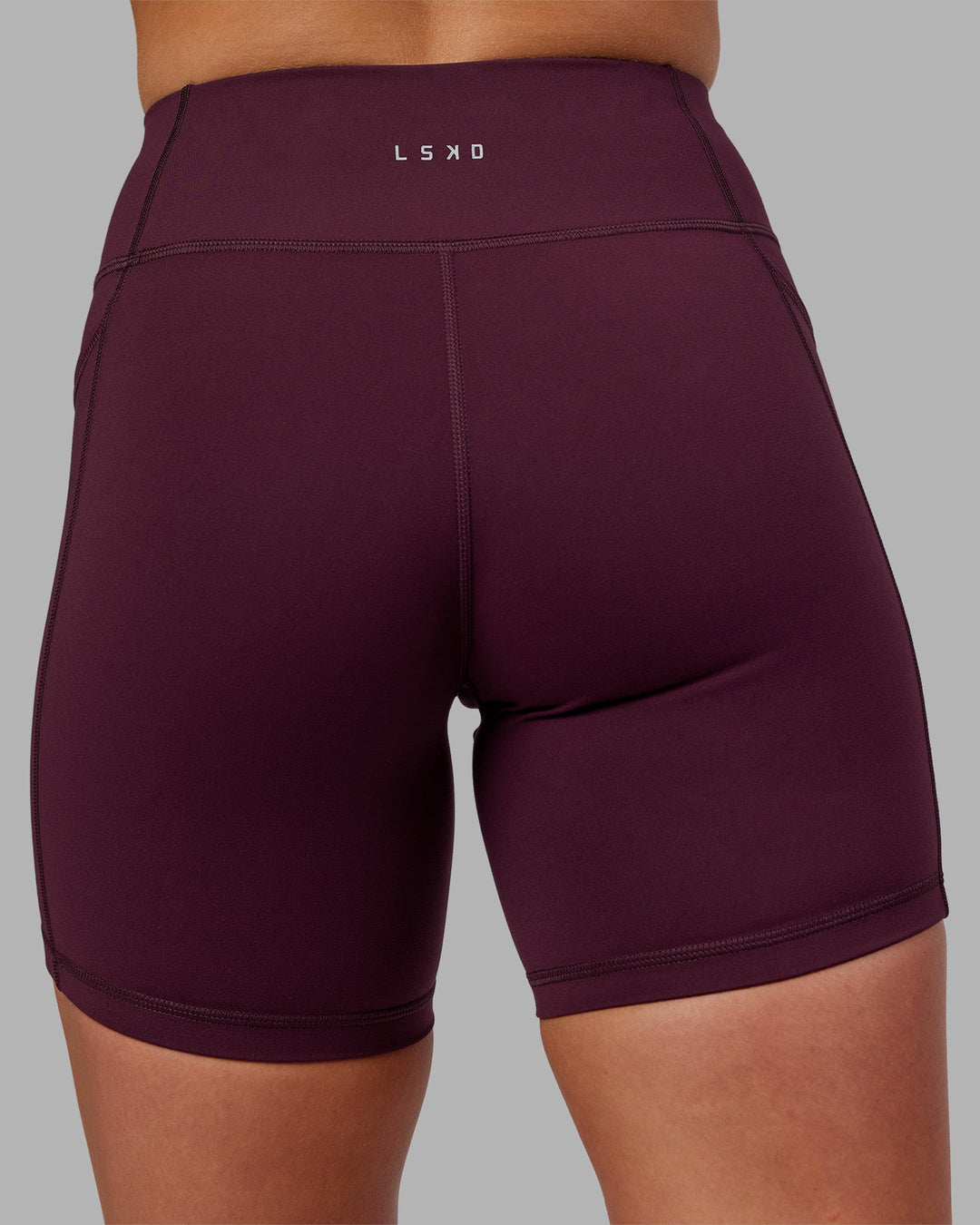 Woman wearing Rep Ultra High-Rise 6&quot; Short Pockets - Cherry Lacquer-White | Model:Keisha | Size:S