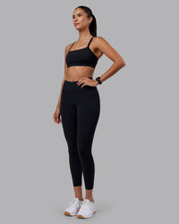 Woman wearing Rep Ultra High-Rise 7/8 Legging Pockets - Black-Black | Model:Rhiley | Size:S