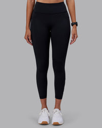 Woman wearing Rep Ultra High-Rise 7/8 Legging Pockets - Black-Black | Model:Rhiley | Size:S