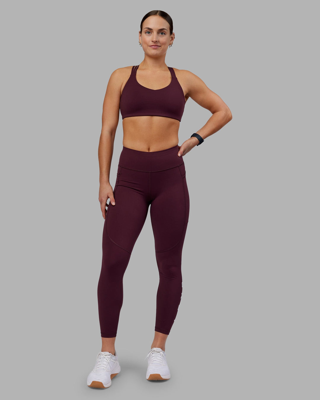 Woman wearing Rep Ultra High-Rise 7/8 Legging Pockets - Cherry Lacquer-White | Model:Keisha | Size:S
