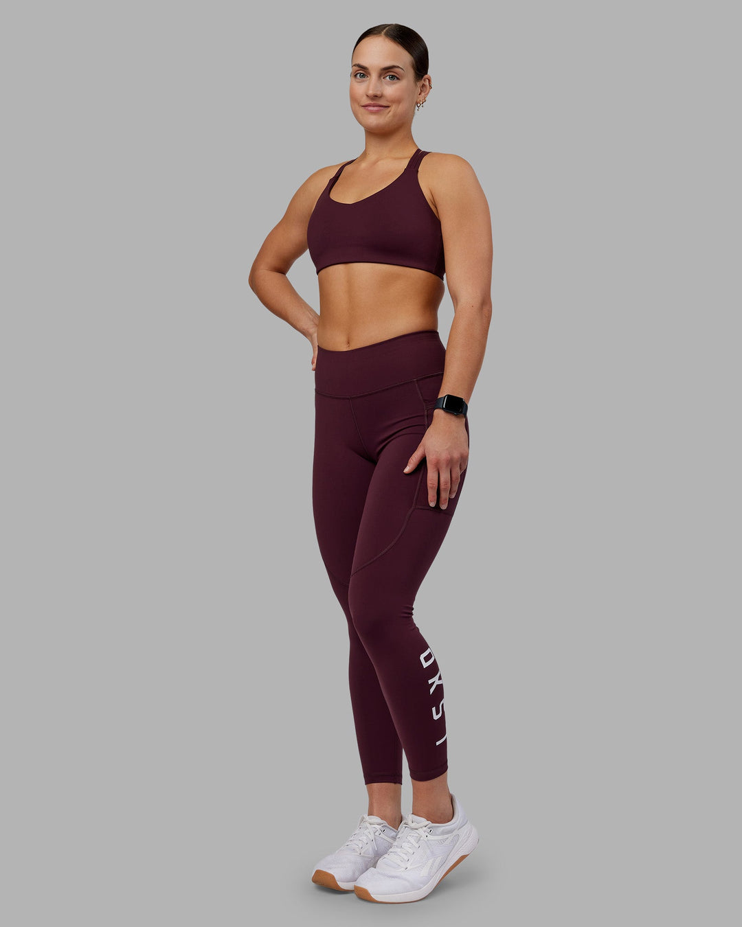 Woman wearing Rep Ultra High-Rise 7/8 Legging Pockets - Cherry Lacquer-White | Model:Keisha | Size:S