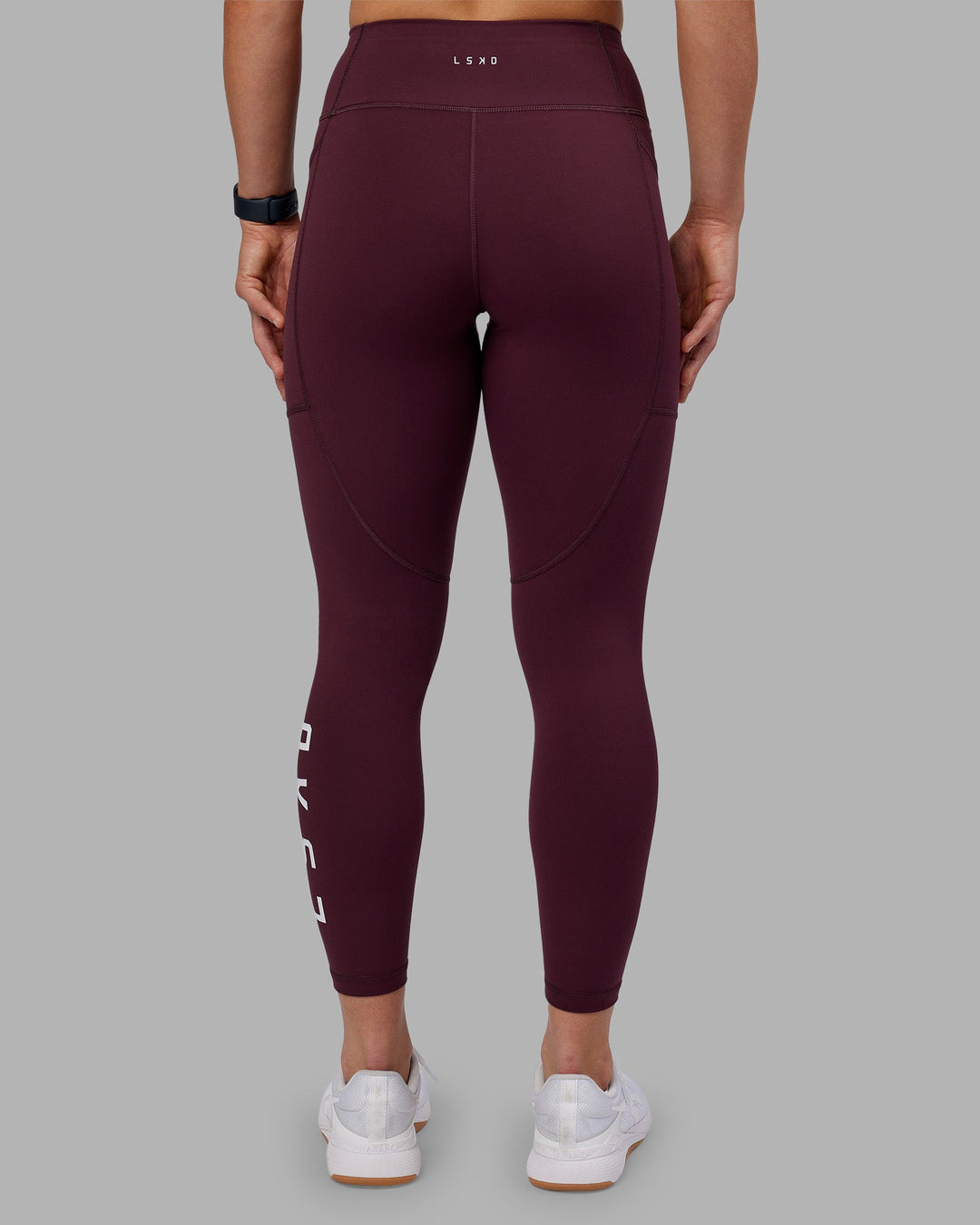 Woman wearing Rep Ultra High-Rise 7/8 Legging Pockets - Cherry Lacquer-White | Model:Keisha | Size:S
