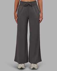 Woman wearing Restore CloudFLX Wide Leg Pant - Dark Storm | Model:Paris | Size:S