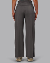 Woman wearing Restore CloudFLX Wide Leg Pant - Dark Storm | Model:Paris | Size:S