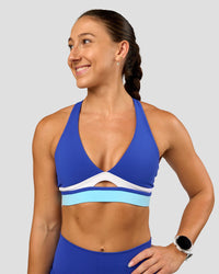 Woman wearing Revitalise Flash Sports Bra - Electric Indigo-Multi | Model:Summer | Size:S