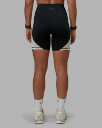 Woman wearing Revitalise Ultra High-Rise 6" Short - Black-Multi | Model:Tylah | Size:S | Thumbnail Index: 3
